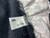 3M L-126 label visible on the black fabric edge. White inner shroud material showing minimal wear and crinkling.
