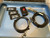 Open blue case lid holding three ZETEC patches, a reset box and two coiled cables