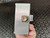 PolyPhaser surge protector showing brushed aluminum finish, minor surface scratches, and clean N-type female connector.