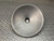 Underside of the black lid showing the open bowl and round recess at center