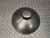 Black ice bucket lid seen from above at an angle with its multi-sided knob