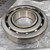 NACHI stamped on outer race face and inner race top; open design with visible ball complement; brushed steel finish, no visible damage.