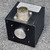 Black anodized housing with label readable: Serial 1849PB1, Part 1716-0100-S-IND12-6-S-S-Y, +5 to 28VDC. 6-pin MS connector on top; machined shaft hub on front face.