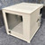 Cream-painted steel enclosure with slot positions marked 1-4, ADC logo on front, HRE-204 stamped on base. Interior visible, no cards installed.