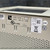 Label on perforated beige chassis: HRE-204 L 3A, INPUT -48V DC 0.5A, serial 1238736, UL listed E191387, OK and HI-POT OK stickers present.