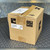 ADC-branded cardboard box with label showing HRE-204 L3A and code 224305011. Box shows tape wear and corner creasing.