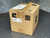 Closed ADC carton taped shut with shipping labels and handling symbols