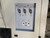 Rear panel with three fittings, two smaller ports and a fan