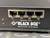 Black Box ServSensor V4E front panel showing four E1-E4 expansion ports and company logo.