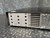 Rear corner with vent holes, louvers and a barcode label