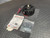 Warner Electric EM-50-20FBB Electromagnetic Brake from Obtainium Science and Surplus shown with installation manual, hardware bag, and wiring on a textured black floor mat.
