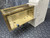 Isco Restrictor Heater unit with a bright brass-colored internal chamber and off-white exterior housing.