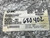 Detailed closeup of an SMC product label on clear bubble wrap packaging for a CM2E32200Z Air Cylinder. The white label clearly displays "SMC Corporation of America" and "PART NUMBER: CM2E32200". It also shows "QUANTITY: 1", "PACKED BY: 2987", "PACK LOCN: LOS ANGELES PLANT", and "DATE PACKED: 04/06/05 14:00". Additional printed details include "308577 002 01" and "W/O: 323524". A handwritten number "680402" is visible in black marker. This industrial pneumatic cylinder label provides key specifications for the 32mm bore and 200mm stroke component, ensuring accurate identification for customers searching for SMC parts.