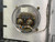 Rear view of a Telewave PM5C1S Automatic Alarm Panel for RF Power Systems, featuring a clear, circular Hoyt meter or gauge mounted on a brushed aluminum back panel. The image clearly shows robust electrical connections with two large brass terminals secured by nuts and washers, to which multicolored wiring including white, blue, orange, yellow, and grey wires are attached. A small white label is visible inside the transparent housing, displaying "HOYT MADE IN U.S.A." and an upsidedown number "29222," providing a detailed look at the industrialgrade components and wiring of this RF power system monitoring equipment.