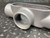Appleton 1-1/2-inch T57 Grayloy FM7 conduit body showing internal threading and rugged material texture.