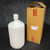 4000ml narrow mouth laboratory bottle made of translucent white HDPE, shown next to its original corrugated cardboard packaging box which features "OBER" branding and a label with a QR code.