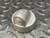 Killark EYS-1 Electrolet 1/2 inch conduit fitting resting on a metal diamond plate surface.