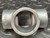 Killark EYS-2 1-inch conduit fitting, showing the internal bore and external "FM" marking on the side.
