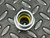 Cooper Crouse-Hinds CG100 750 strain relief connector with a yellow internal grommet, top-down view.