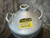 Close view of the yellow CAUTION EXTREMELY COLD liquid nitrogen sticker