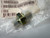 Eaton Weatherhead Steel Hex Nipple Fitting, 3/8" x 1/8" NPT Male from Obtainium Science and Surplus, shown inside a plastic bag with a barcode label in the background. The fitting has a hexagonal nut and threaded ends.