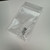 Two small silver screws for the National Instruments SCB-68 terminal block in a clear plastic bag.