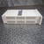 Side view of the Varian Multi-Gauge Vacuum Controller from Obtainium Science and Surplus, resting on a metal-patterned surface, showing ventilation slits on the side panel.