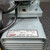 Close-up view of the model number and specifications plate on the Gast Vacuum Diaphragm Pump from Obtainium Science and Surplus, providing details about the pump’s electrical requirements.