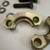 Inside face of a yellow zinc clamp half showing the machined flange shoulder
