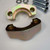 Two yellow zinc clamp halves showing the machined flange shoulder and bolt holes