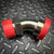 Bright metal 45 degree split flange elbow adapter with red caps on both ends