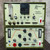 A detailed view of a stacked Dimetrics Orbital Welding Centaur 75 TIG Welder system, featuring two robust olive green industrial control units. The top unit, a Dimetrics Centaur 7008 Sequence Controller, displays a clear gas flow rotameter, a digital counter/timer, rotary dials for prepurge and postpurge timing (010 sec), toggle switches for manual gas, weld time, and water control, and various connectors for gas, water, and remote operation. The bottom unit, a Dimetrics Centaur 7001 TIG Welder controller, features multiple rotary controls for weld current (075 Amps), low pulse width (099%), low pulse frequency (099 PPS), and background current (075 Amps), along with sequence start/stop buttons, slope up/down dials, and additional connections. Both units proudly display the Centaur logo and Dimetrics Inc. branding, with prominent red AC power switches, ideal for precision industrial arc welding applications.