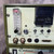 Detailed view of a Dimetrics Centaur 75 TIG Welder (models 7001, 7008) control panel, showing the beige interface mounted in an olive green industrial frame. The panel features a clear Dwyer rotameter for SCFH AIR flow, a purge timer dial adjustable to 10 seconds, and a digital timer/counter module displaying '0190'. Input/output connections for 'GAS IN', 'GAS OUT', 'WATER IN', 'WATER OUT', and a 'REMOTE OUT' port are visible alongside toggle switches for 'MAN GAS', 'MAN WELD TIME', and 'MAN WATER' in auto/manual modes. The lower section identifies the unit as 'Centaur' and '75' for weld current, highlighting this orbital welding equipment's precise control capabilities.