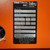 Detailed product label for a Dimetrics Talley Industries Centaur 75 TIG Welder, Model 7008, Serial No. 244, prominently displayed on an orange machine casing. This vintage orbital welding equipment label, manufactured February 1985 (285), shows key specifications: 117 VAC input voltage, 60 Hz frequency, single phase power, and a 0.1 KVA output. The black and silver nameplate also lists the Dimetrics Way address, assembly number 2271000100, several patent numbers including 3,793,798 and 4,386,726, a safety warning, and confirms 'Made in USA'.