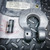 Unused Crosby S-1325A Chain Coupler (1/2-13, Grade 100) on diamond plate, with kit pin and packaging.