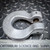 Unused silver Crosby S-1325A Chain Coupler, Grade 100, U-shaped, with 'USA' & 'GR-100' markings on textured background.