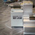 Side view of the SMC MY1H16-150L Rodless Actuator 150mm from Obtainium Science and Surplus showing the product label and pneumatic fitting.