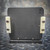 Rear view of 600A-4 mount showing light surface wear on black finish. Two white nylon clamps attached with hex screws.