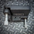 Top-down view of the Newport 600A-4 Kinematic 4" Precision Universal Optical Mount from Obtainium Science and Surplus, showing two precision micrometer adjusters and mounting holes.