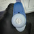 Gloved hand holding the pipettor plunger button that reads 1 to 5 ml
