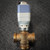 Front view of the actuator on its valve body with ports marked A, AB and B