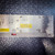 Brushed aluminum top panel with labeled test points including XTAL1, XTAL2, LC1, LC2, 40dB GAIN, and 18.4 LO. Four green LEDs illuminated under INPUT FILTER section. Red LED display active at lower left. Yellow caution labels present. Connectors J101 and J102 visible. MODULE ADDRESS DIP switches and FILTER PROBE port visible. No visible damage or corrosion.
