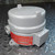 Gray cast aluminum enclosure with red label reading KILLARK CAT. NO. SPM25122 1298 and stamped code 67-0027-03-02 on side tab. Threaded conduit hub visible. No damage observed.