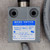 Gray die-cast body, label reads MICRO SWITCH Freeport ILL USA, cat 914CE20-3, 5A-250VAC, 1/10HP-125/250VAC, Made in United Kingdom.