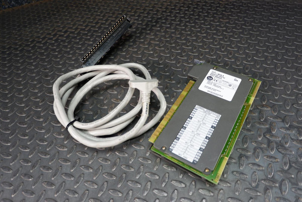 Angled view of an Allen-Bradley 1771-ID16/A Input Module with 1492-CABLE025R from Obtainium Science and Surplus, showing the circuit board and attached gray cable with terminal block.
