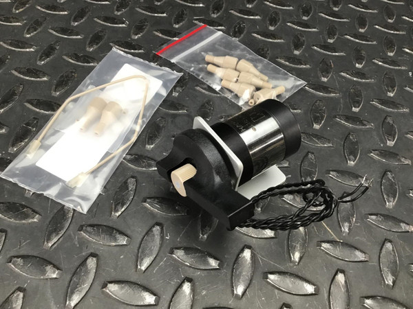 VICI injector with lever handle beside two clear bags of loop and fittings
