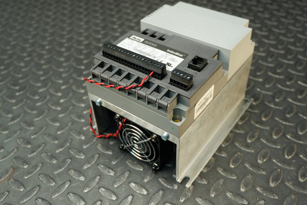 Parker IndexBlok XDM1105E sensorless drive with cooling fan, terminal blocks, and heat sink fins.