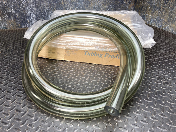 Nalgene 180 clear PVC vacuum tubing, 3/4 inch ID, coiled on a diamond plate surface with packaging visible.