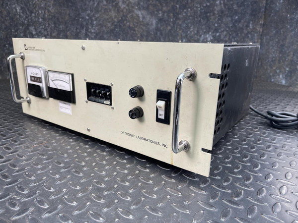 Optronic Laboratories front panel showing general surface wear, minor scratches, intact handles, and "HOURS" meter.