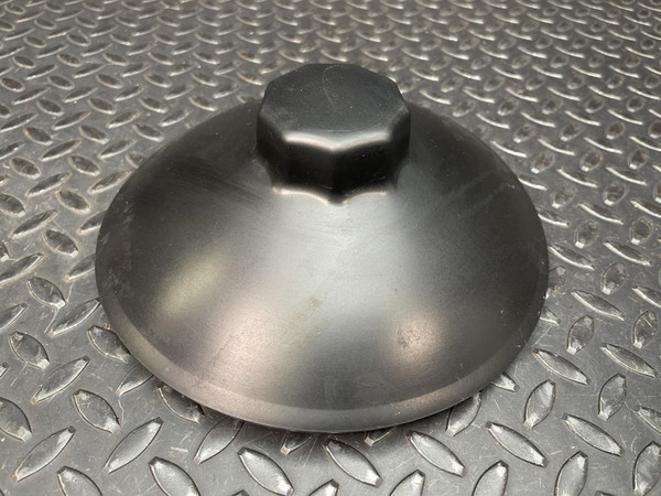 Black domed ice bucket lid with a multi-sided knob on a diamond plate surface